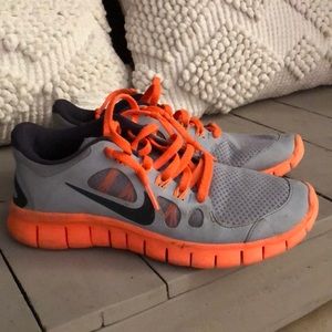 Gray and orange Nike’s youth size 4.5